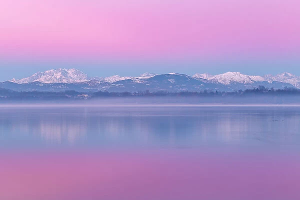 Sunrise on Rosa Mount and Alps reflected in Varese lake, Varese province, Lombardy