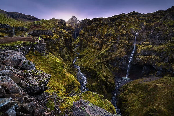 A tourist at Mulagljufur Canyon, southern Iceland, Iceland (MR)
