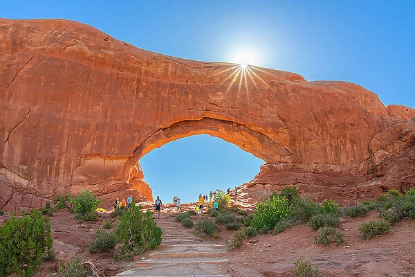 Tourists visiting North Window Arch, Arches National Park, Utah, USA