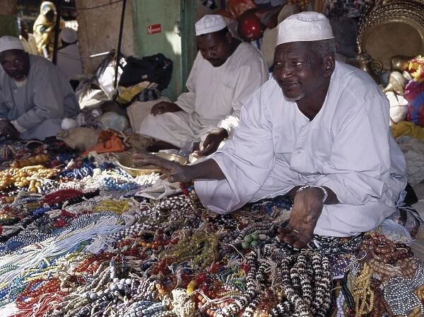Traders offer a large variety of beads for sale in