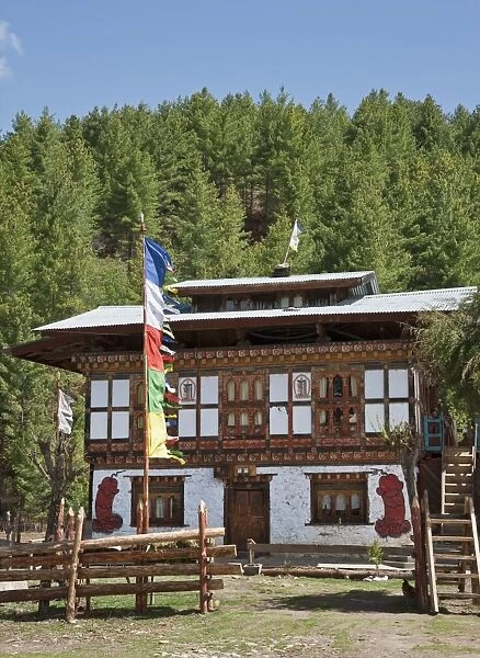 A typical Bhutanese house with phalluses painted on the walls. They are a reminder of a favourite 15th century saint, Lama Drukpa Kunley, the divine madmen, whose sexual exploits