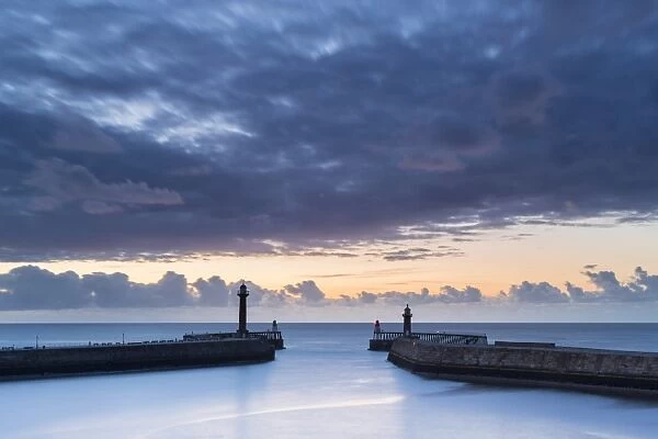 United Kingdom, England, North Yorkshire, Whitby. The Piers at dusk