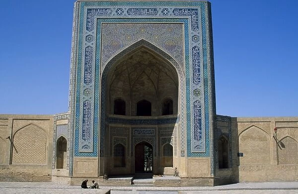 Uzbek men sit outside The Kalan Mosque