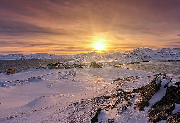 Veines village covered with snow lit by sunrise, Kongsfjord, Varanger Peninsula, Troms og Finnmark, Norway
