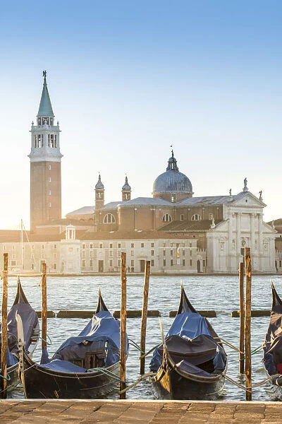 Venice, Veneto, Italy. Gondolas moored in Riva degli Schiavoni and San Giorgio Maggiore