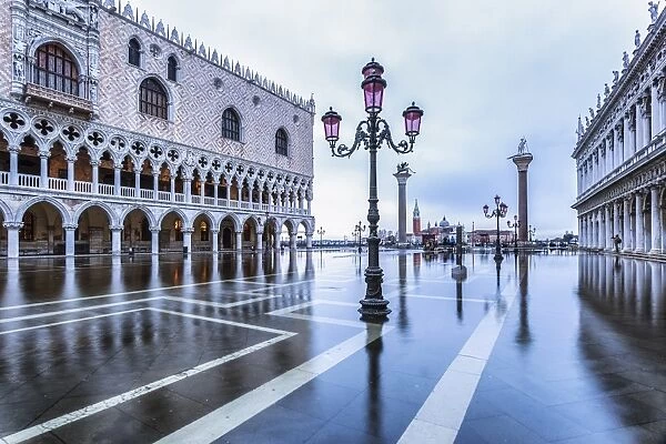 Venice, Veneto, Italy. High water on San Marco Square and Palazzo Ducale on the left