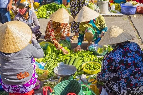 Vietnamese women buying and selling vegetables at An Binh market, Can Tho, Mekong Delta