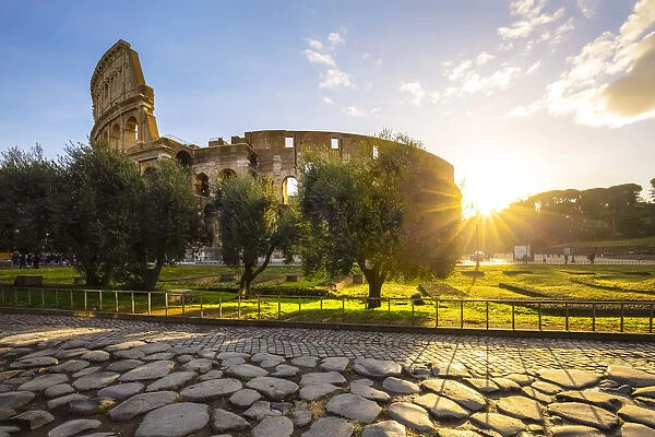 View of the Colosseum during a winter sunrise from the Via Sacra. Rome, Lazio, Italy