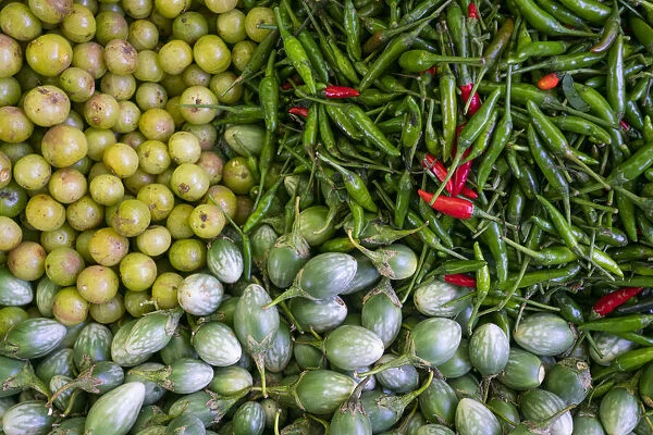 Top view of gooseberry, chili peppers and baby eggplant at local market, Lake Inle