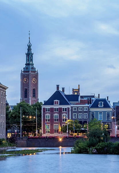 View over Hofvijver towards Grote of Sint-Jacobskerk at twilight, The Hague, South