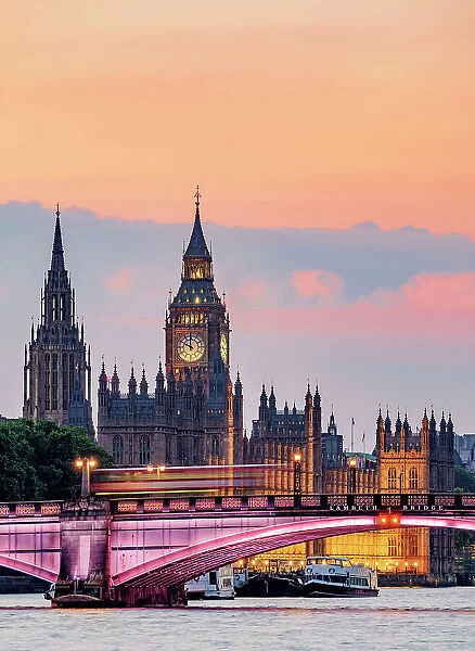 View over the River Thames towards the Palace of Westminster at dusk, London, England, United Kingdom