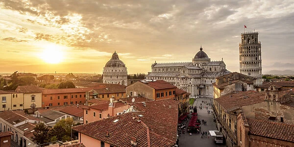 View over Via Santa Maria towards Cathedral and Leaning Tower at sunset, Pisa, Tuscany