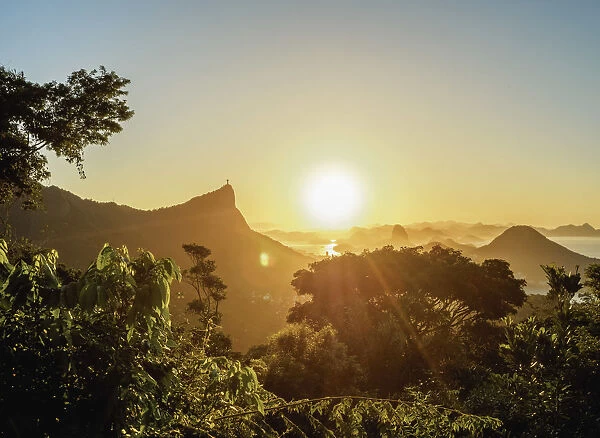View from Vista Chinesa over Tijuca Forest towards Rio de Janeiro at sunrise, Brazil