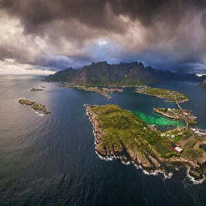 An aerial panoramic view of the whole Reine fjord on a stormy afternoon. Lofoten Islands, Norway
