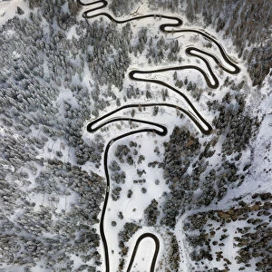 Aerial view of curves of the Maloja pass after a snowfall, Maloja Pass, Bregaglia Valley
