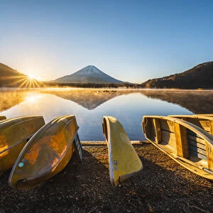 Boats moored at lake Shoji and Mt. Fuji, Yamanashi Prefecture, Japan