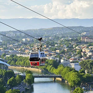 Bridge of Peace and the Mtkvari river. The famous Cable Car above. Tbilisi, Georgia