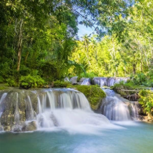 Cambugahay Falls surrounded bu jungle foliage, Lazi, Siquijor Island, Central Visayas