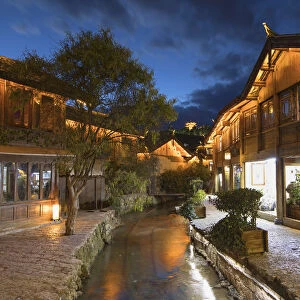 Canalside buildings at dusk, Lijiang (UNESCO World Heritage Site), Yunnan, China