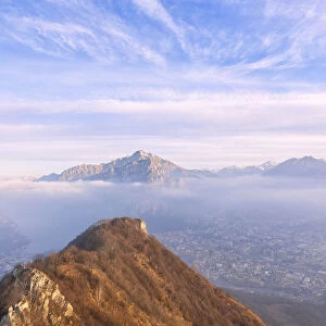 City of Lecco and the village of Valmadrera under the morning fog