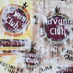 Cuba, Trinidad, Havana Club painted on wall of bar in historical center