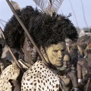 A Dassanech man in full tribal regalia participates