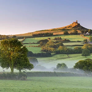 Early morning mist in the rolling farmland below Brentor at dawn, Dartmoor National Park
