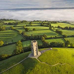 Early morning mists at St Michaels Tower on Glastonbury Tor in Somerset, England. Autumn (September) 2020