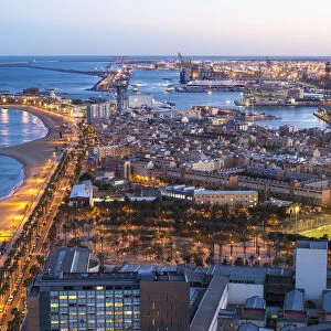 Elevated dusk view over Barcelona beaches and seaport, Barcelona, Catalunya, Spain
