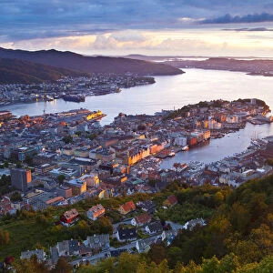 Elevated view over central Bergen illuminated at sunset, Bergen, Hordaland, Norway