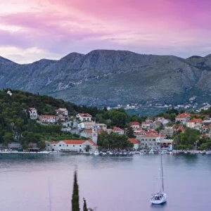 Elevated view over picturesque harbor town of Cavtat illuminated at sunset, Cavtat