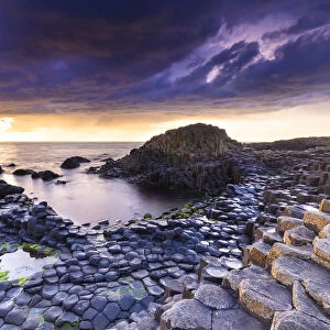 An epic sunset at the Giants Causeway with its iconic basalt columns
