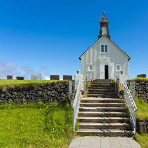 Facade of Strandarkirkja church with steps on sunny day, Selvogur, Reykjanes Peninsula, Iceland
