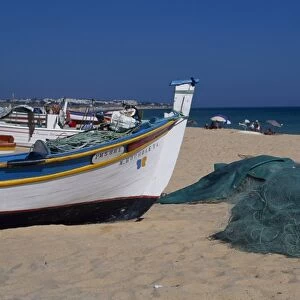 Fishing boats and nets on the beach