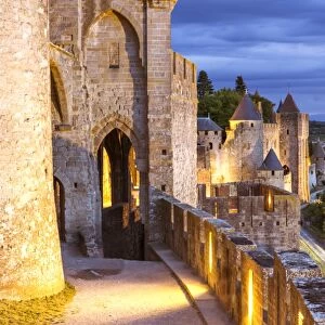 France, Languedoc-Roussillon, Aude, Carcassonne. Walls and towers of the old town at dusk