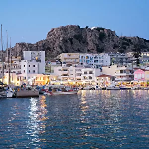 Greece, Dodecanese, Karpathos, the illuminated port city of Pigadia in the evening
