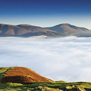 Hiker Overlooking Low Cloud From Catbells, Lake District National Park, Cumbria, England