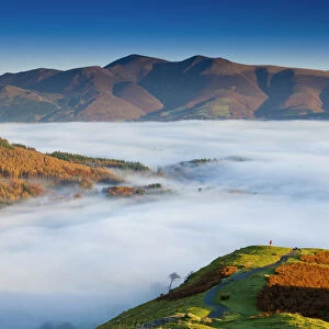 Hiker Overlooking Low Cloud From Catbells, Lake District National Park, Cumbria, England