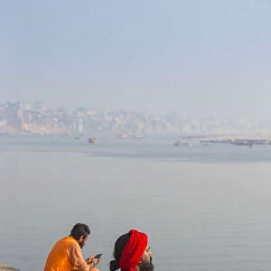 India, Uttar Pradesh, Varanasi, Holy men on banks of Ganges River