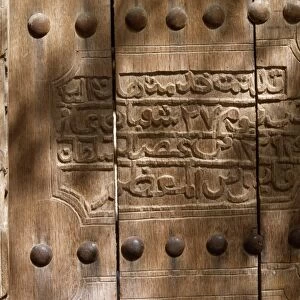 An inscription on the wooden door of the