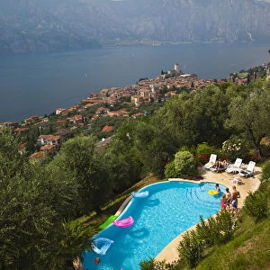 Italy, Veneto, Lake District, Lake Garda, Malcesine, hillside pool and town