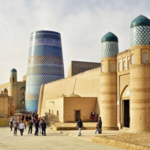 The main gate to the Khuna Ark citadel and the Kalta Minor minaret. Old town of Khiva