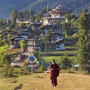 Monk leaving Gangtey Dzong (monastery), & village, Phobjikha Valley, Bhutan