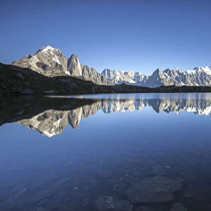 The Mont Blanc mountain range reflected in the waters of Lac de Chesery