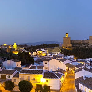 Moorish Alcazaba (castle) & city overview illuminated at dusk, Antequera, Malaga Province