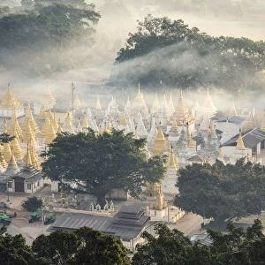 Myanmar, Shan state, Pindaya. Nget Pyaw Taw Pagoda at sunrise, elevated view