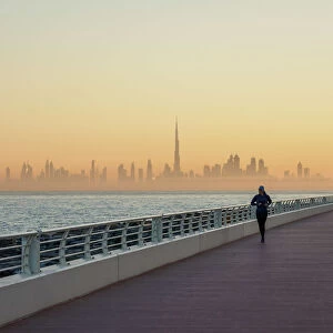 Palm Jumeirah Boardwalk and City Centre Skyline at sunrise, Dubai, United Arab Emirates