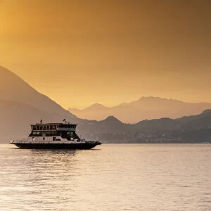 Passenger ferry on Lake Como at sunset, Varenna, Lombardy, Italy