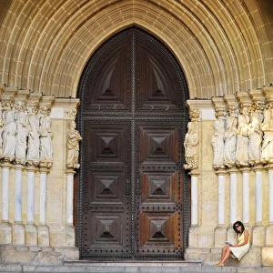 Portugal, Alentejo, Evora, Evora cathedral, woman reading (MR)