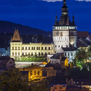 Romania, Transylvania, Sighisoara, elevated city view Old Town and clocktower, dusk